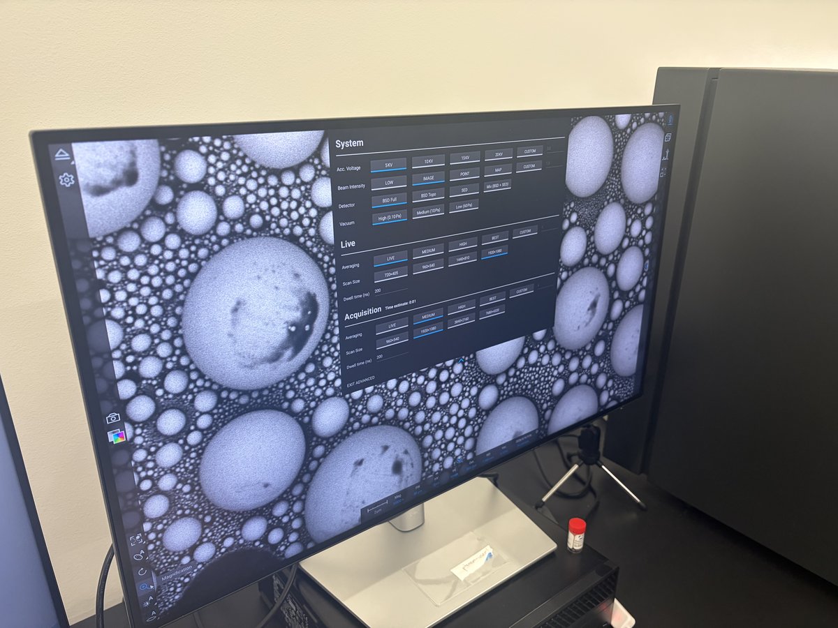 Phenom Pharos monitor showing the settings panel overlaid on live SEM images of Sn ball samples