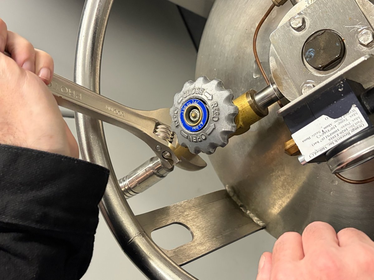 Using wrench to close the LIQUID valve