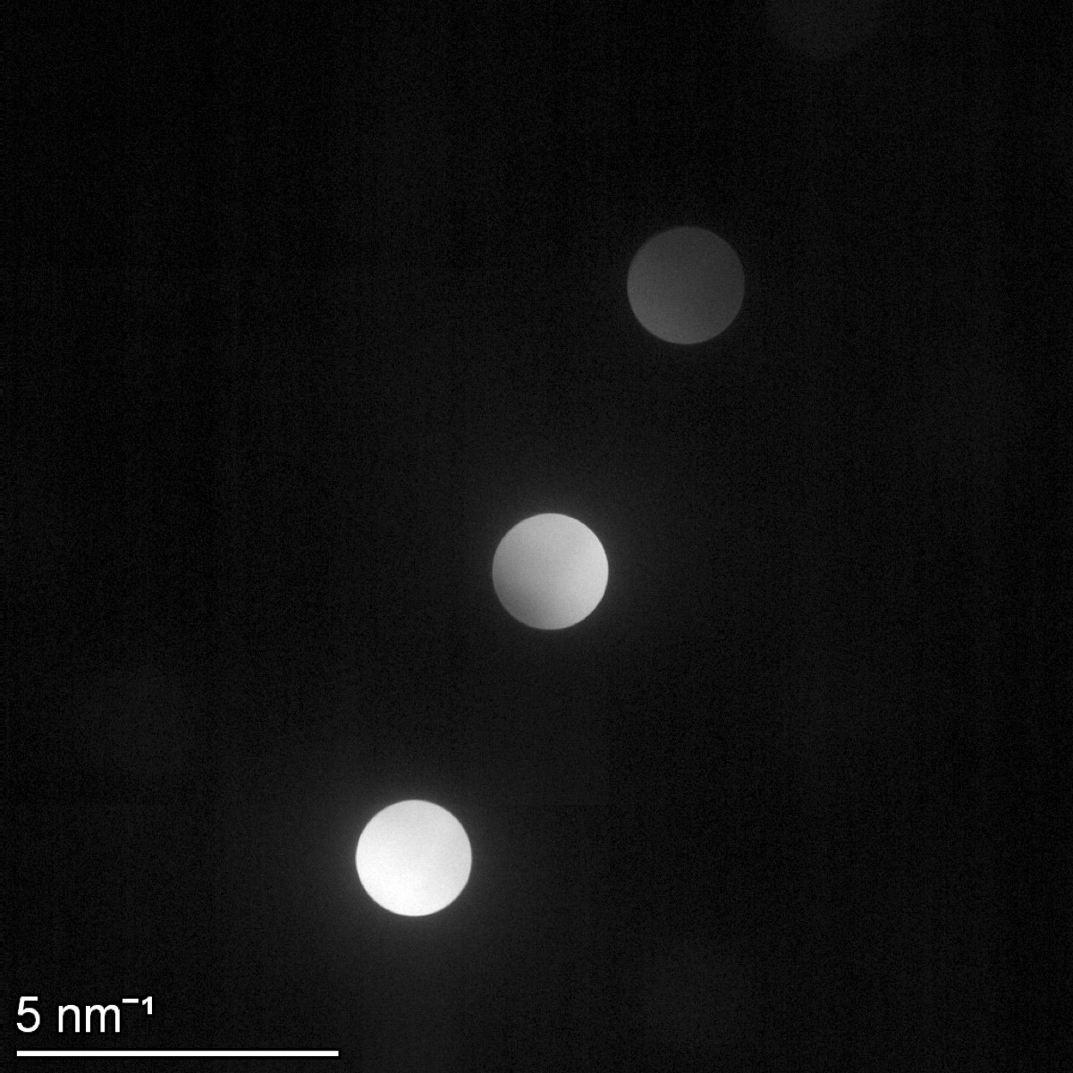 Ceta diffraction image at camera length 1.05 m showing the focused central disk plus three gold 200 Bragg spots at 5 per nanometer scale
